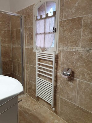 Shower, hair dryer, towels, toilet paper