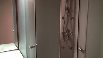 Shower, hair dryer, towels, toilet paper