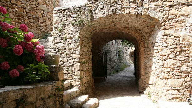 An arched stone doorway leading into a stone building. - A gîte of character and grand comfort in the heart of nature  3*** (St Laurent le Minier)