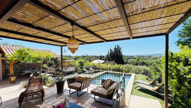 A covered outdoor area with a pool, seating, and a view of the landscape. - Adorable villa with private swimming pool and a superb view of the mountains (Eyragues)