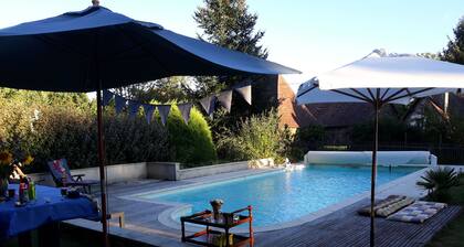 Old house located on an apple-red fruit farm