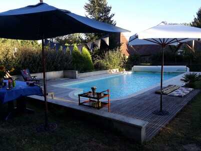 Old house located on an apple-red fruit farm