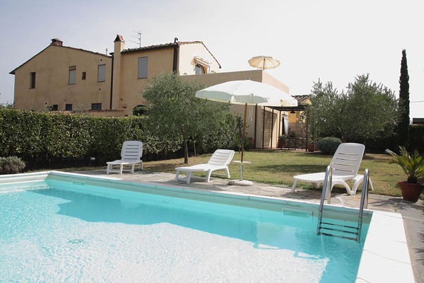 The pool in the private garden and patio