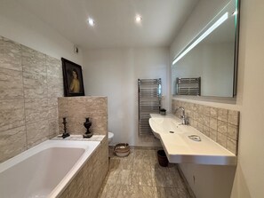 Bathtub, hair dryer, towels