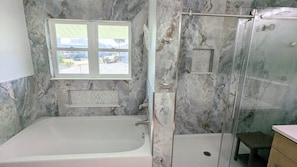 Combined shower/tub, hair dryer, towels, soap