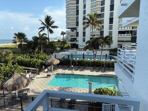 Outdoor pool, a heated pool - SOMERSET #213 2 BR 2 Bth- Beautiful Beachfront Paradise . Aug Sept Oct Promotion (Marco Island)
