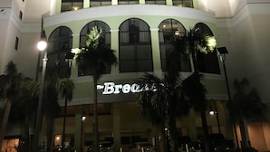 A tall hotel with multiple floors, large windows, and a sign reading "The Bre."