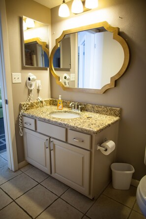 Combined shower/bathtub, hair dryer, towels, toilet paper - PREMIUM Beach Front One Bedroom at Phoenix V (Orange Beach)