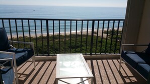 A balcony with a view of the beach and ocean. - SPACIOUS OCEAN FRONT PARADISE (Fort Pierce)