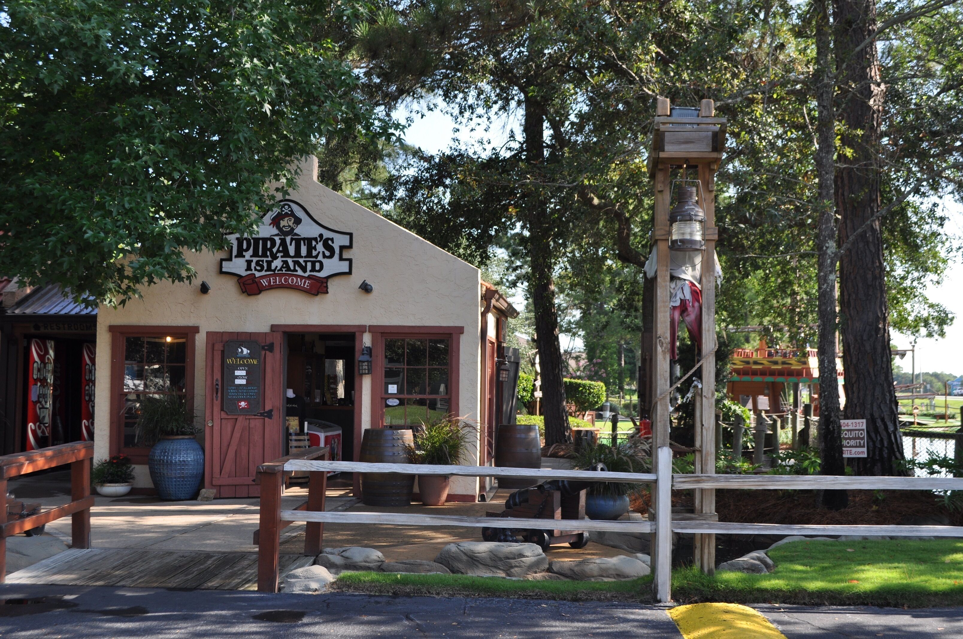 A building with a sign reading "Pirate's Island Welcome".