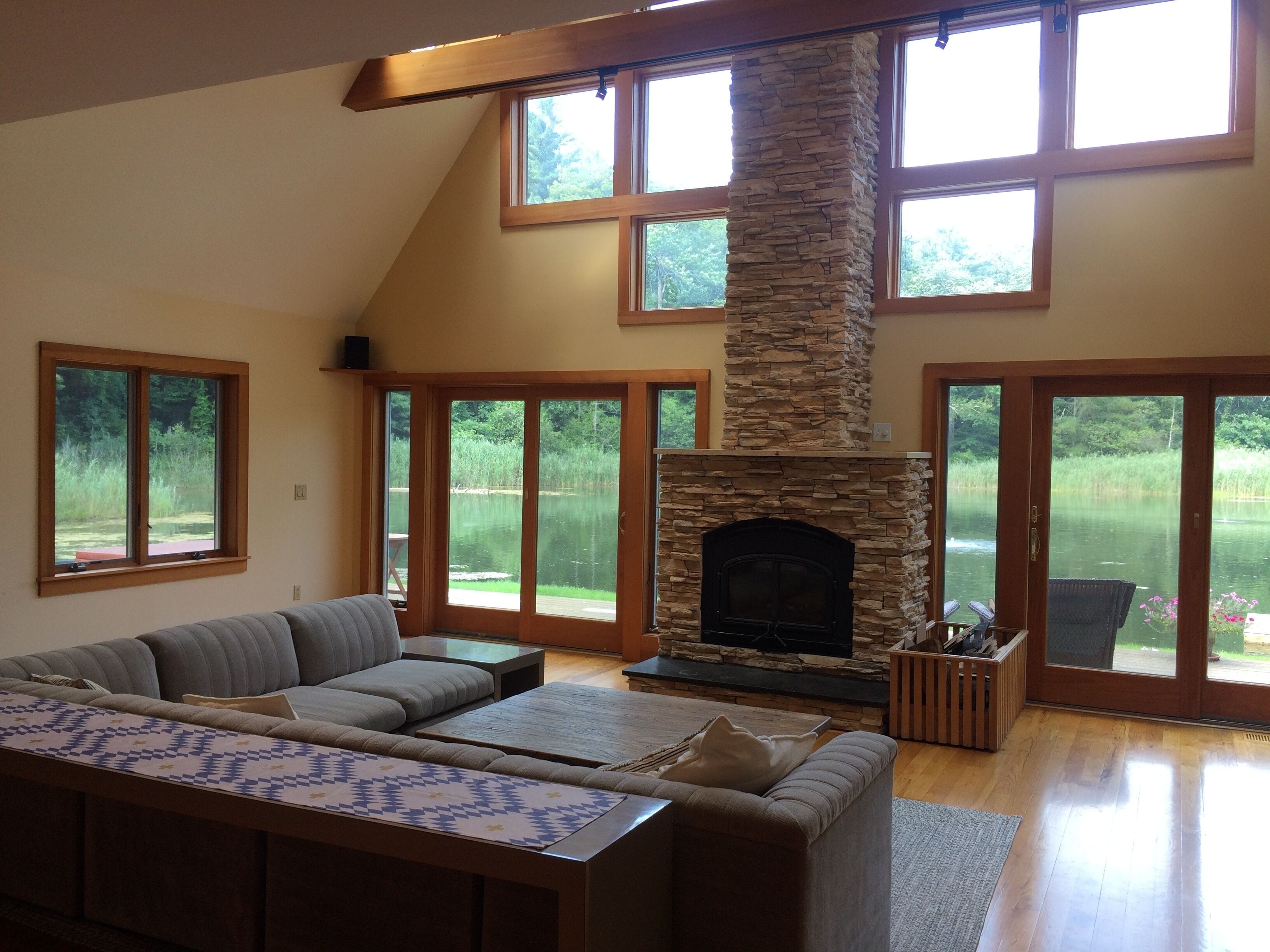 The great room with wonderful water views and working fireplace
