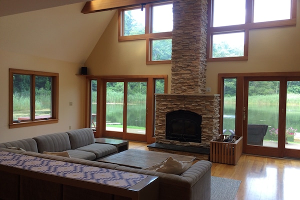The great room with wonderful water views and working fireplace