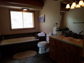 Combined shower/bathtub, hair dryer, towels, soap