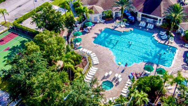 An aerial view of a resort with a large swimming pool, tennis courts, and palm trees. - R-disney Palms Retreat -  3 Miles To Walt Disney World (Kissimmee)
