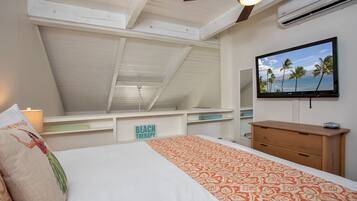 A bedroom with a bed, a ceiling fan, a TV, and a view of the sky.