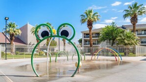 A water play area with frog-shaped structures and a building in the background. - Las Palmas! Beds for 9-10! 3Bed 2Bath, Bunks for kids! Huge deck! (St George)