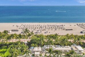 On the beach, sun-loungers, beach towels
