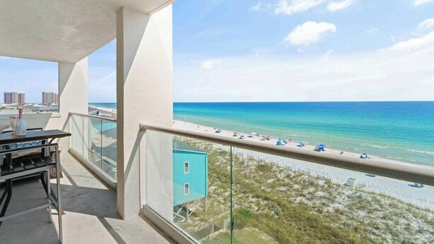 A balcony with a view of the beach and ocean. - Multi-Family, sleeps 12, GULF FRONT with BEACH VIEWS FROM EVERY ROOM (Pensacola Beach)