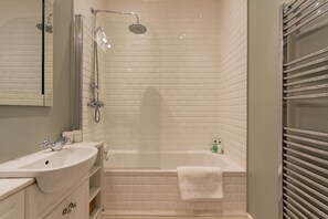 Combined shower/tub, hair dryer, towels, soap