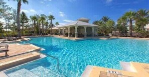 A swimming pool with lounge chairs and a gazebo. - 6-Seater Golf Cart & 6 Bikes! Newly Furnished! 2 Resort Pools! Sunset at Seagrove on 30A (Santa Rosa Beach)