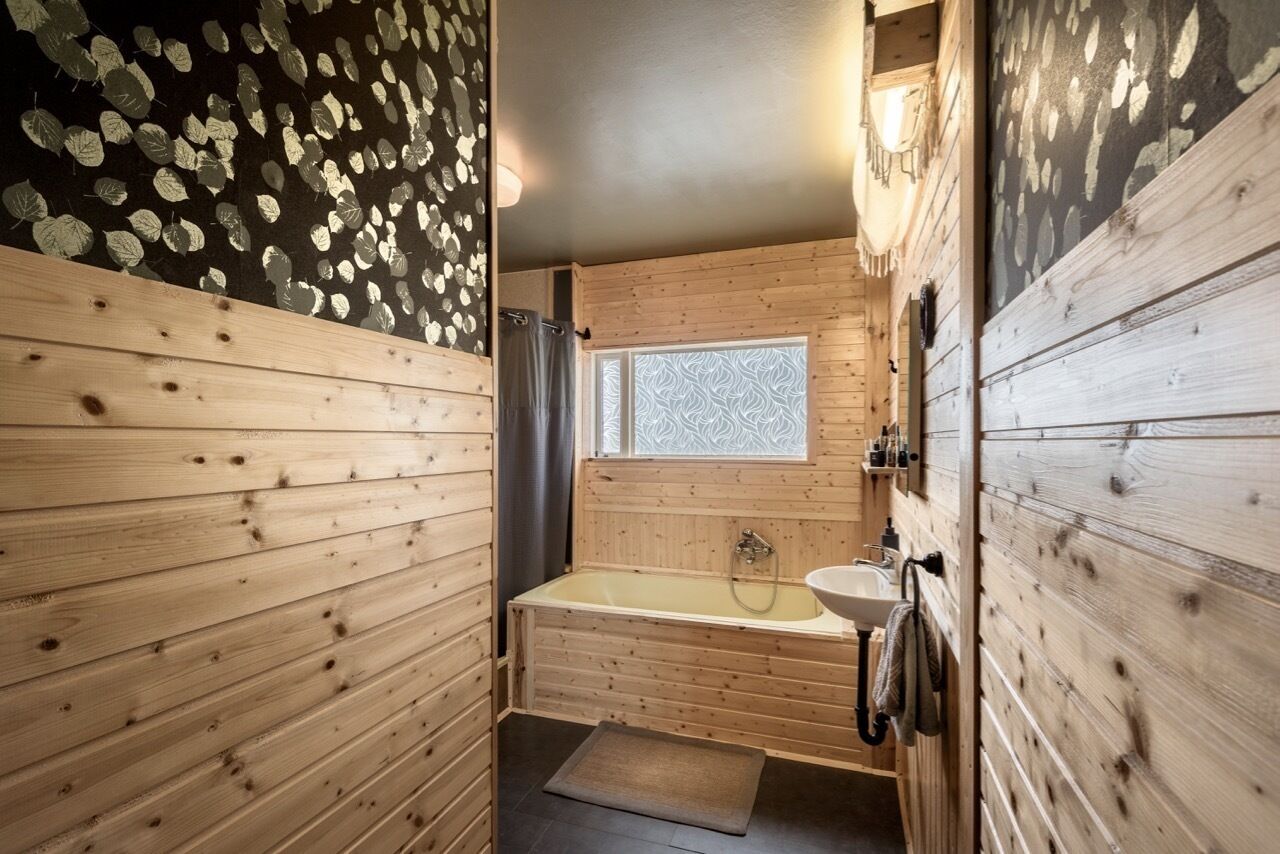 Bathtub, eco-friendly toiletries, hair dryer, towels