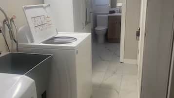 Combined shower/tub, hair dryer, soap, shampoo