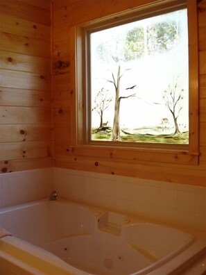 Shower, jetted tub, towels, soap