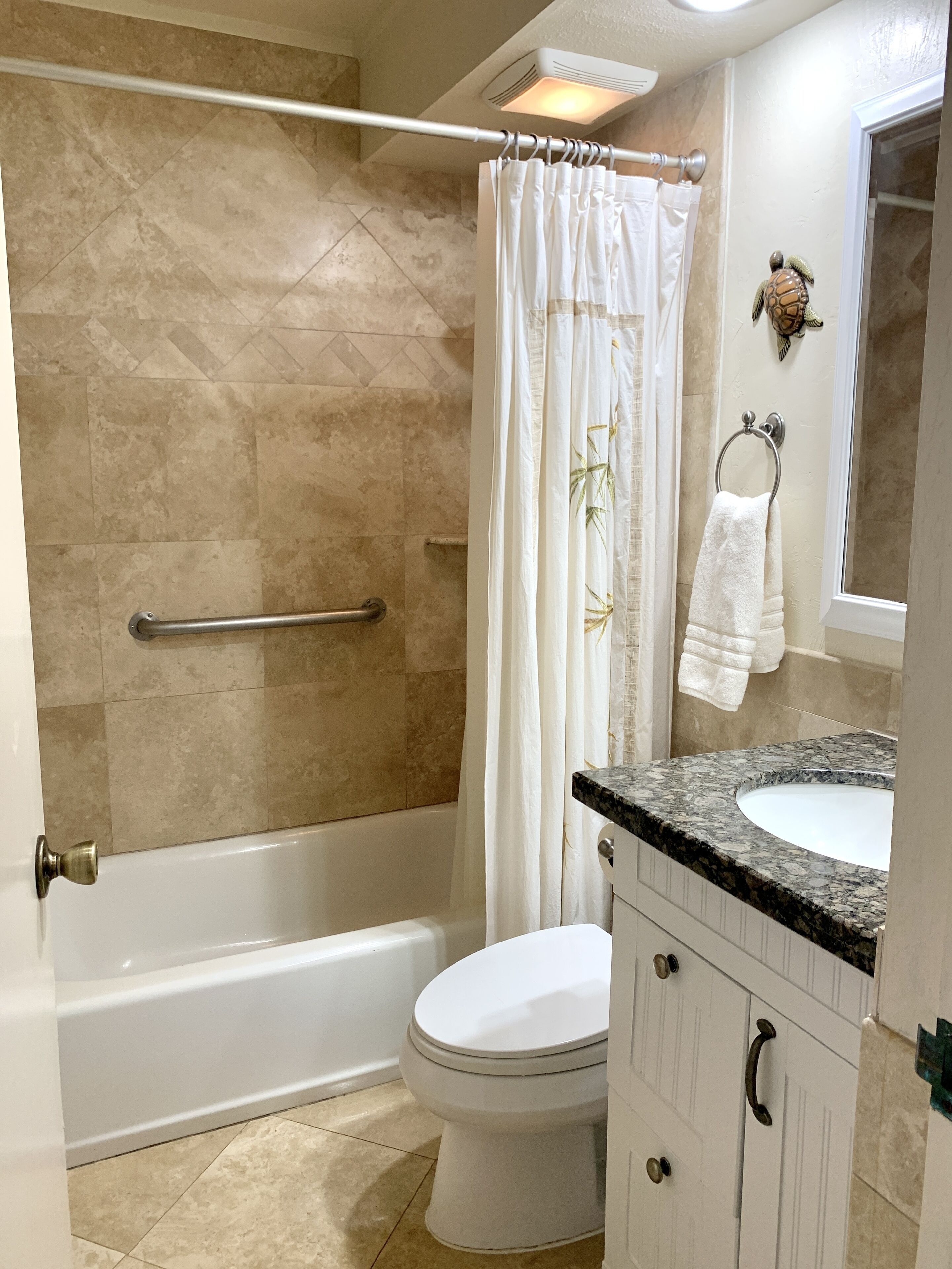 Combined shower/tub, hair dryer, towels, soap