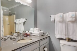 Combined shower/tub, hair dryer, towels, soap