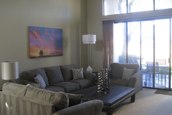 Comfortable, large, open living room includes 50' flat screen