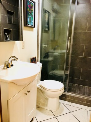 Shower, hair dryer, towels, soap