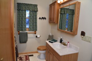 Bathtub, hair dryer, towels, soap