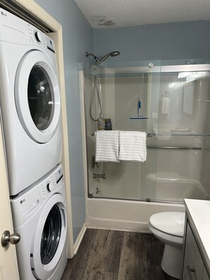 Combined shower/tub, towels - Relax Oceanfront at our 2-bedroom Oceanfront condo in Carolina Beach (Carolina Beach)