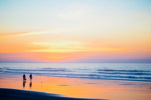 Walk along the wide, open beach and enjoy the sound of gentle waves lapping at the shore.