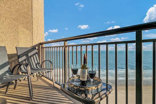 Updated oceanfront penthouse with beach chairs and no parking or resort fees