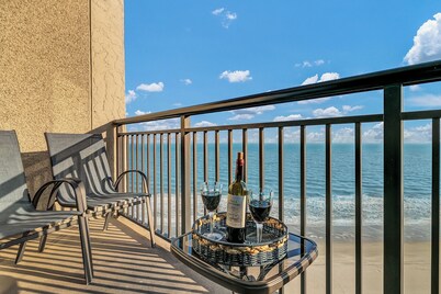 Updated oceanfront penthouse with beach chairs and no parking or resort fees