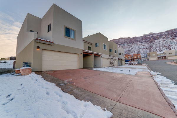 Driveway for 2 large vehicles plus 2 medium size car parking in garage.