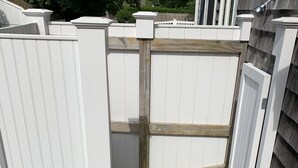 A wooden deck with a white fence and a wooden gate. - Walk from your family friendly house to the beach, downtown, or Wychmere Resort (Harwich Port)
