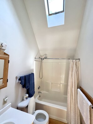 Combined shower/bathtub, hair dryer, towels, soap