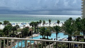 A resort with a pool area, beach, and ocean view. - Beach Front/Free Beach Chair Service & Wifi/ Reserved Parking/ Best Amenities (Panama City)