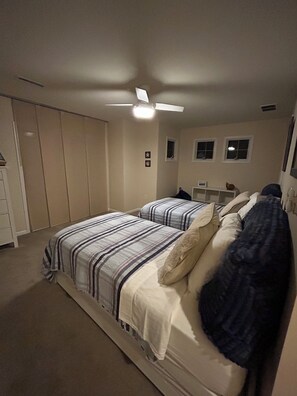 A bedroom with a bed, a ceiling fan, a wardrobe, and a window. - Booking 2027. 4 Level Townhome, Rare Find! (Ocean City)