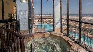 A corner balcony with a view of the beach and a pool. - LAVISH OCEAN OASIS! DIRECTLY on the GULF, POWDERED SAND - ABUNDANT AMENITIES! (Orange Beach)