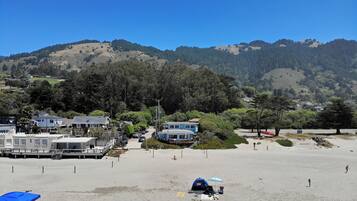 On the beach, sun loungers