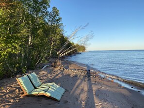 On the beach, sun-loungers