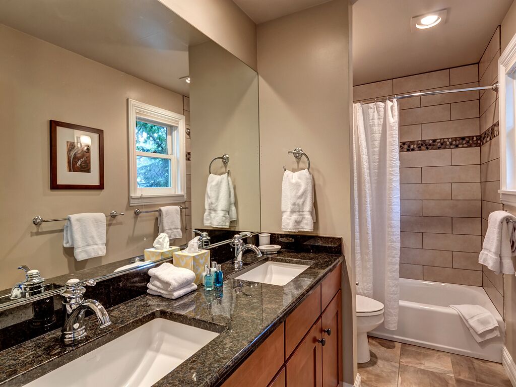 Bathtub, hair dryer, towels, soap