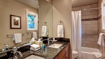 Bathtub, hair dryer, towels, soap