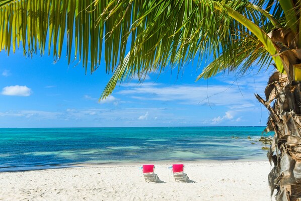 On the beach, sun loungers, beach towels
