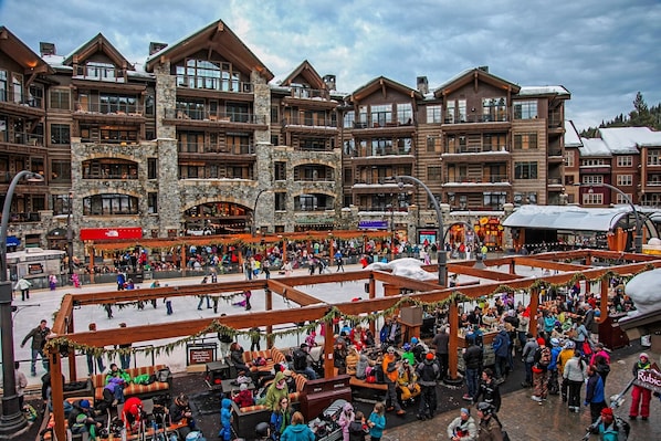 A large, multi-story hotel with stone and wood architecture, featuring balconies and large windows. - Luxury Top Floor Residence in the Village at Northstar - Catamount 403 (Truckee)