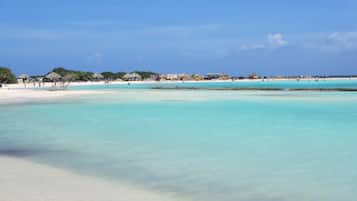 On the beach, sun loungers, beach towels