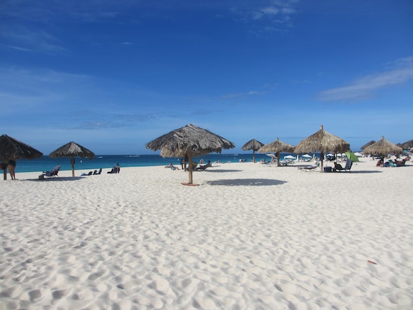 On the beach, sun-loungers, beach towels